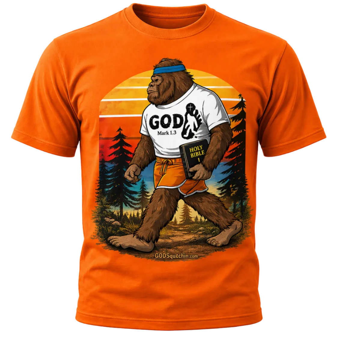 Orange T-shirt featuring a bold, retro-style illustration of a Bigfoot walking through a forest at sunset, wearing a “GOD – Mark 1:3” shirt and holding a Holy Bible, with “GODSquatchin.com” subtly printed at the bottom of the design.